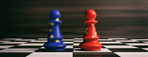 China and European Union flags on chess pawns on a chessboard. 3d illustration stock photo