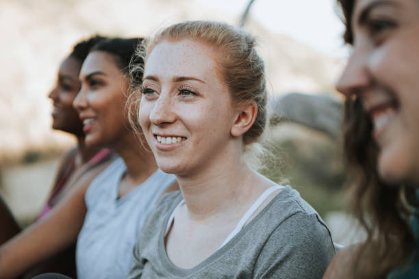 istock Friends relaxing on a park bench 1053768594