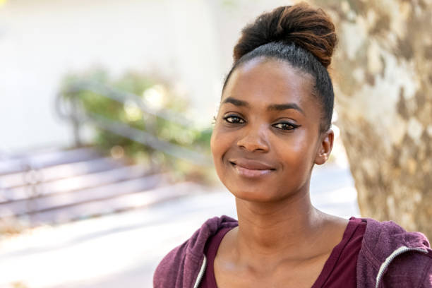 istock Smiling beautiful young black woman 1053768918
