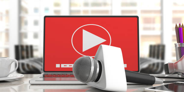 istock Microphone with blank box and a computer on blur office background. 3d illustration 1053768980