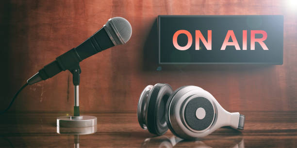 ON AIR written on a black box, headphones and a microphone. 3d illustration