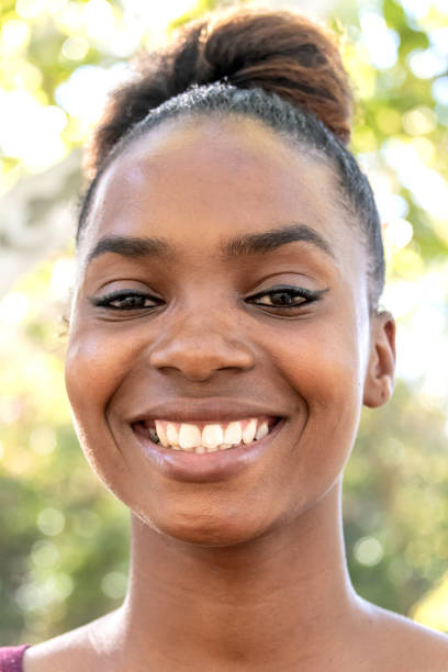 istock Smiling beautiful young black woman 1053769170