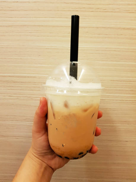 istock Pearl bubbles iced milk tea on brown background 1053770334