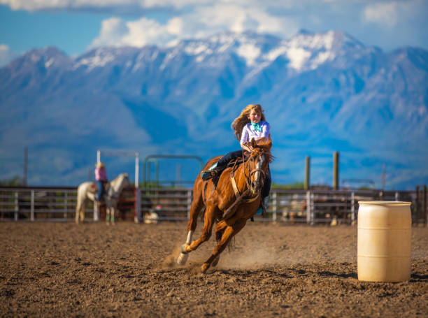 istock Young cowgirl barrel racing rodeo 1053772332