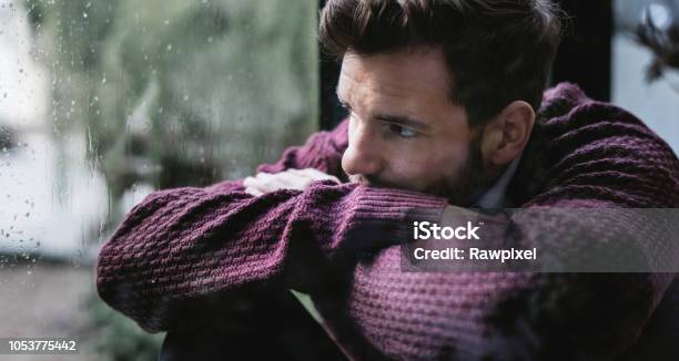 A Man Looking Out Window Stock Photo - Download Image Now - Men, Sadness,  Looking Through Window - iStock