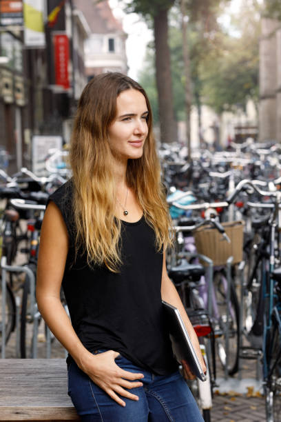 istock University Student With Laptop Outdoors 1053777064