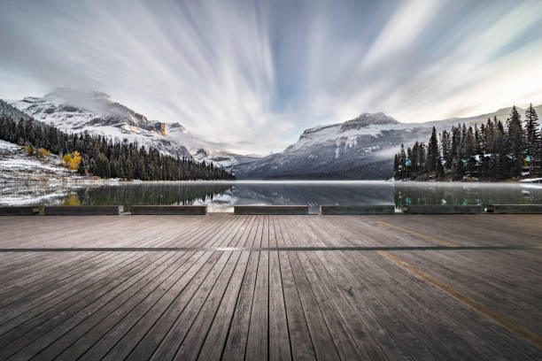 istock empty wooden plank front of  Emerald lake against milky way 1053777214