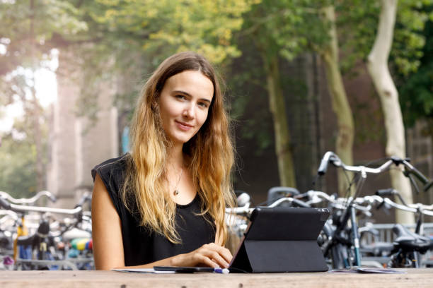 istock Female Student Working On Tablet Outdoors 1053777372