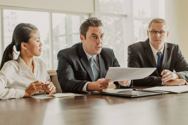 istock Business Group Negotiating at Meeting Hall 1053783016