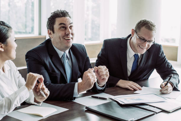 istock Group of Business People Celebrating Success 1053783082
