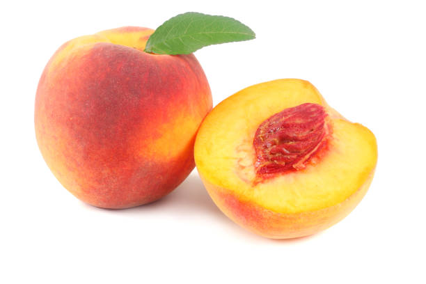 istock peach fruit with green leaf and slices isolated on white background 1053796330