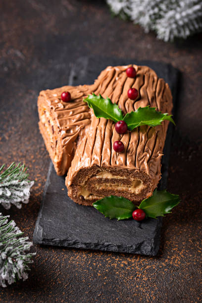 istock Christmas yule log cake. Traditional chocolate dessert 1053807486