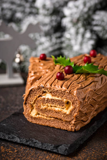 istock Christmas yule log cake. Traditional chocolate dessert 1053807522