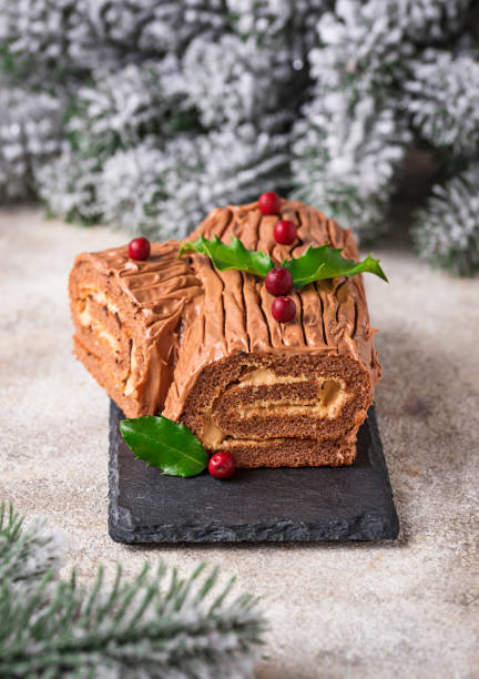 istock Christmas yule log cake. Traditional chocolate dessert 1053808262