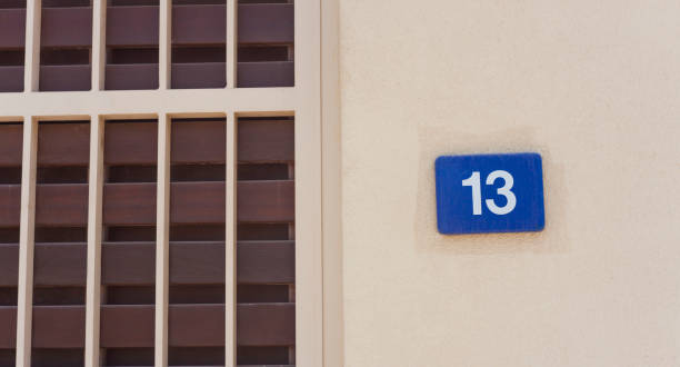 istock number 13 sign on the wall, bad luck 1053809654