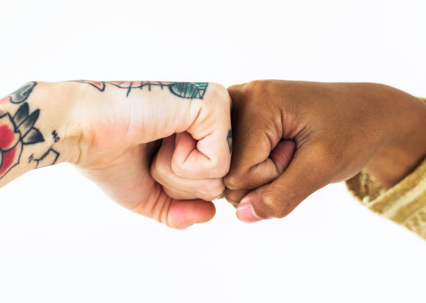 istock People bumping their fists together 1053814690