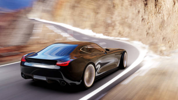 istock black car driving on a mountain road 1053817256