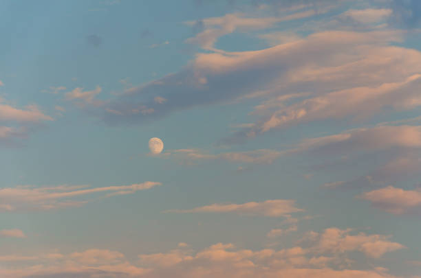 Beautiful evening sunset with the moon in the sky