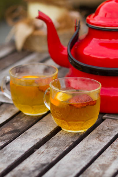 istock tea and red teapot on the table 1053829240