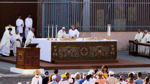 Pope Francis Bergoglio celebrates the Corpus Domini mass at Sant Monica Square in Ostia Lido - Rome Ostia Lido - Rome, Italy June 3, 2018: Pope Francis Bergoglio celebrates the Corpus Domini mass at Sant Monica Square in Ostia Lido a district of Rome. cardinal clergy stock pictures, royalty-free photos & images