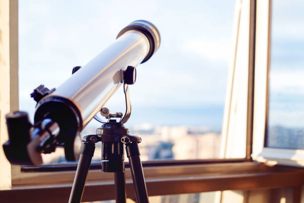 istock telescope on the balcony, Telescope on the tripod. 1053831842