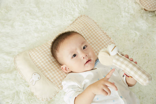 istock The little boy was lying in bed playing 1053832176