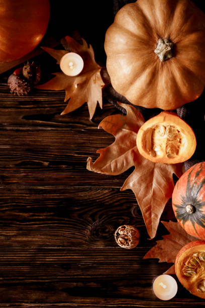 istock Autumnal composition with pumpkins on wooden table. November mood concept. 1053832454