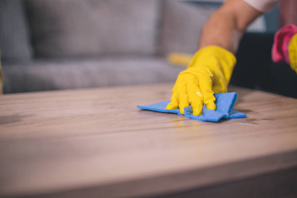 istock Man cleaning the house helping his wife 1053832574