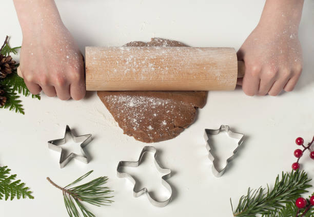 istock Christmas baking. Making christmas gingerbread cookies at home. 1053833598