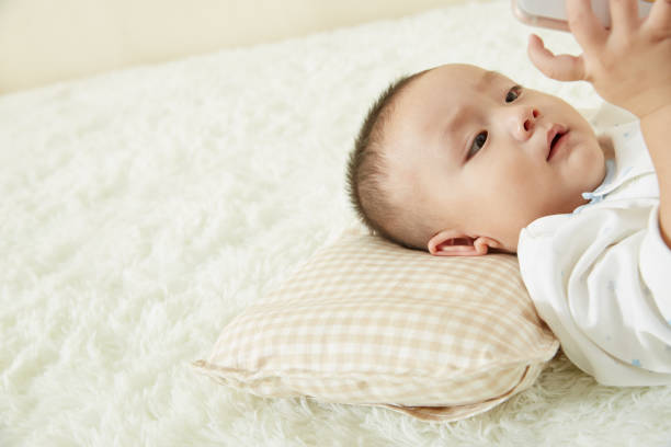 istock The little boy was lying in bed playing 1053833882