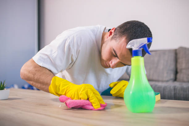 istock Man cleaning the house helping his wife 1053834476