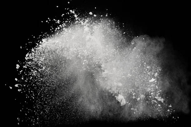 istock White powder or flour explosion isolated on black background; freeze stop motion object design 1053839118