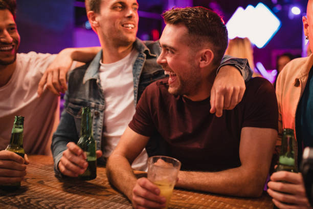 istock Group of Men Buying Drinks from the Bar 1053840412