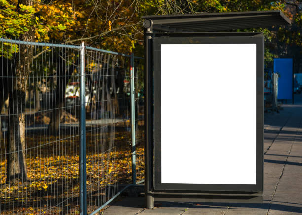 istock Blank bus stop advertisement billboard in urban city environment. Transportation blank white isolated ad space 1053840922
