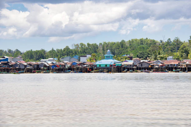 istock water village along a river in borneo island 1053844104