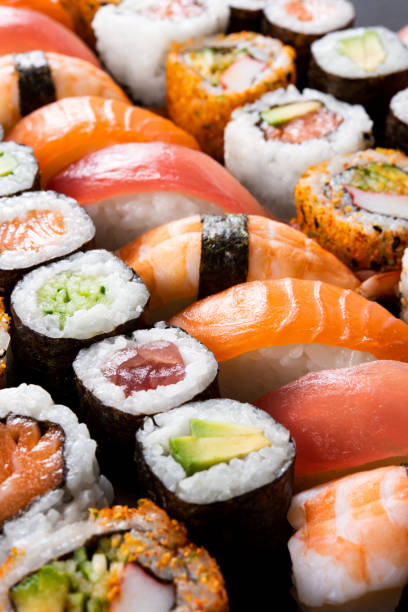 Sushi food Variety of sushi food. Top view of nigiri, maki, hosomaki, uramaki and roll with tuna, salmon, avocado and shrimp. Traditional asian food with raw fish and rice. All you can eat concept. rainbow crab stock pictures, royalty-free photos & images