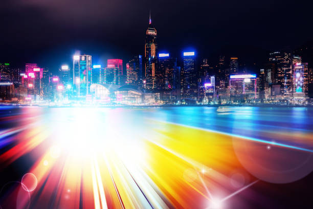 istock Abstract Light trails background with Hong Kong City scraper. double exposure 1053853978