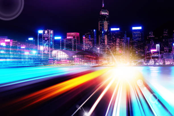 istock Abstract Light trails background with Hong Kong City scraper. double exposure 1053854030