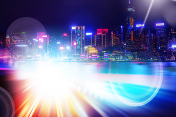 istock Abstract Light trails background with Hong Kong City scraper. double exposure 1053854146