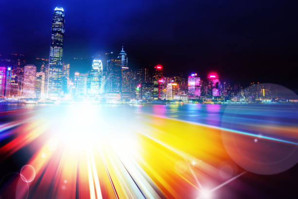 istock Abstract Light trails background with Hong Kong City scraper. double exposure 1053854154