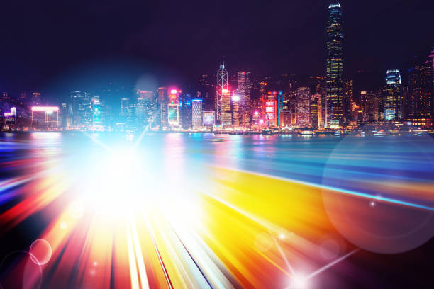 istock Abstract Light trails background with Hong Kong City scraper. double exposure 1053854160