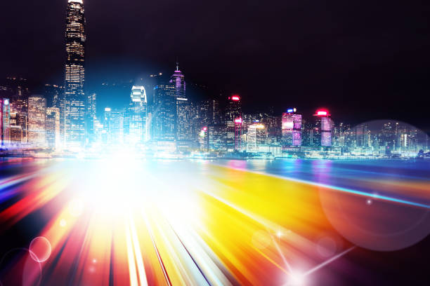 istock Abstract Light trails background with Hong Kong City scraper. double exposure 1053854284
