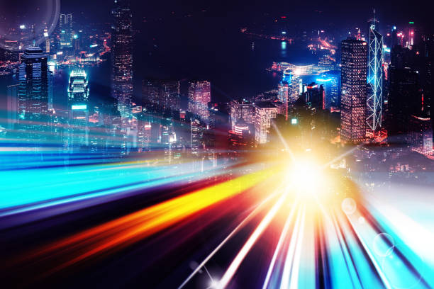 istock Abstract Light trails background with Hong Kong City scraper. double exposure 1053854374
