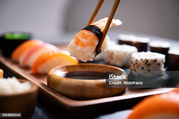 Chopstick With Nigiri Sushi Piece Stock Photo - Download Image Now - Sushi, Japan, Food