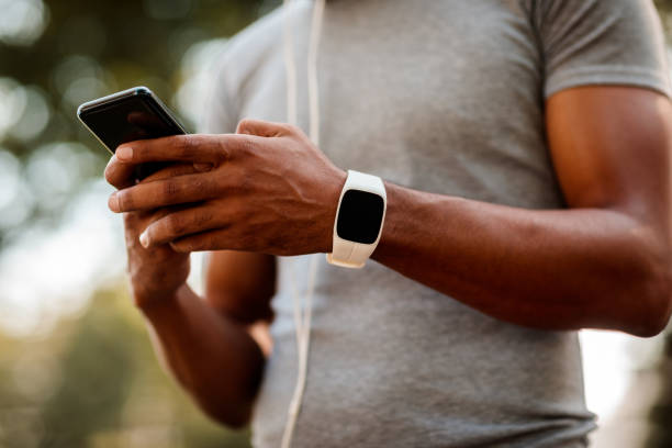 istock Sportsman texting on smartphone 1053860212