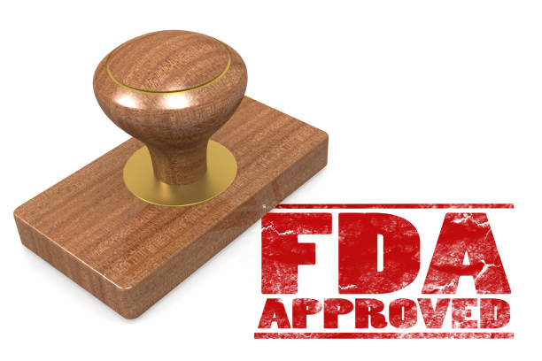 FDA approved red rubber stamp FDA approved red rubber stamp  image with hi-res rendered artwork that could be used for any graphic design. food and drug administration photos stock pictures, royalty-free photos & images