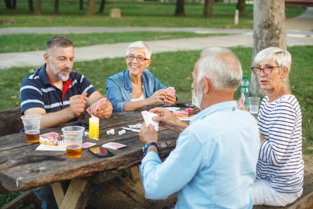 istock Senior people playing cards game 1053864302