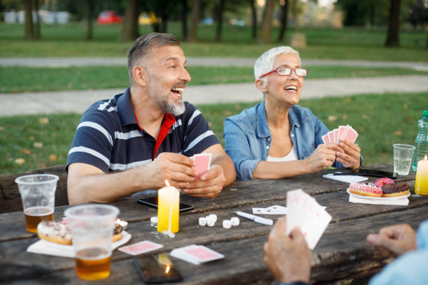 istock Senior people playing cards game 1053864498