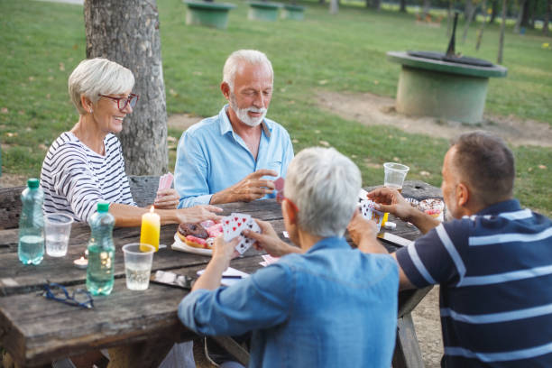 istock Senior people playing cards game 1053864660