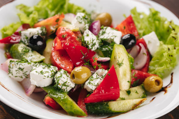 istock Greek salad on a white plate 1053864798